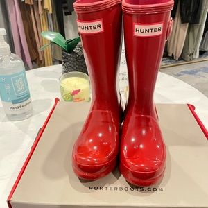 Brand new hunter rain boots for kids in the color red.